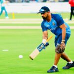 T Dilip Indian team fielding coach with fielding bat doing drill 2021