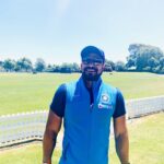 T Dilip posing at cricket ground in 2019